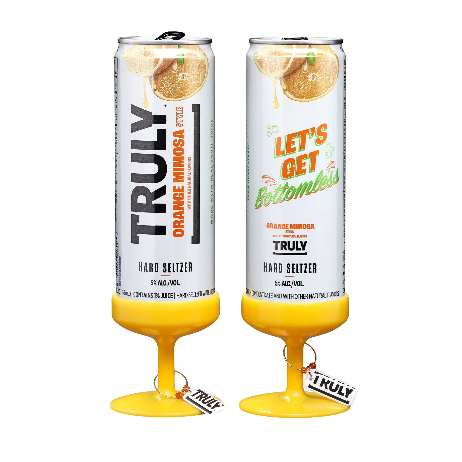 Two tall, slim cans of Truly Hard Seltzer Orange Mimosa, each with a yellow base shaped like the bottom of a stemmed glass, on a white background. The left can has "TRULY ORANGE MIMOSA" text and the right can has "LET'S GET bottomless" text.