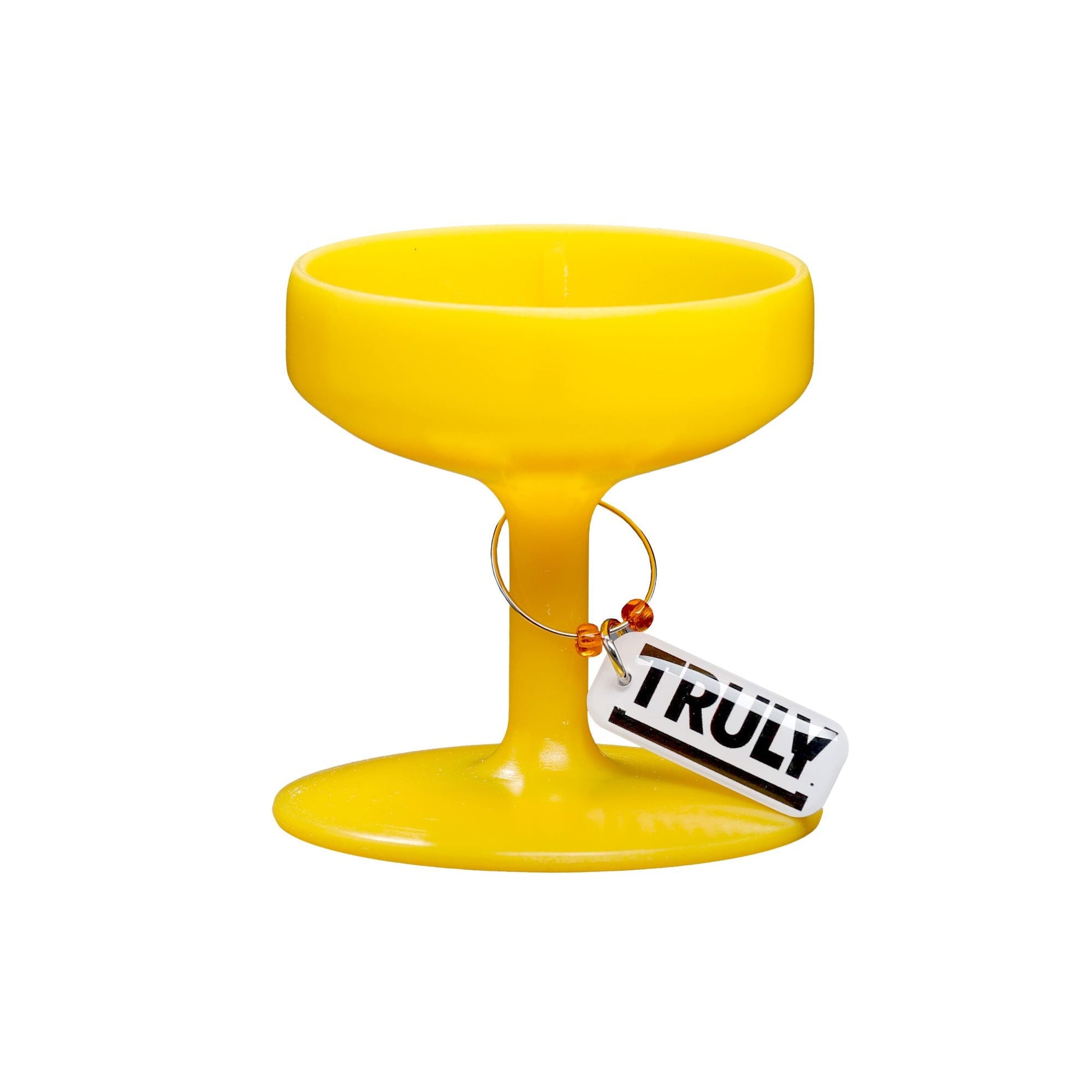 A single yellow plastic base shaped like the bottom of a stemmed glass with a "TRULY" tag attached, designed to hold a Truly Hard Seltzer can.