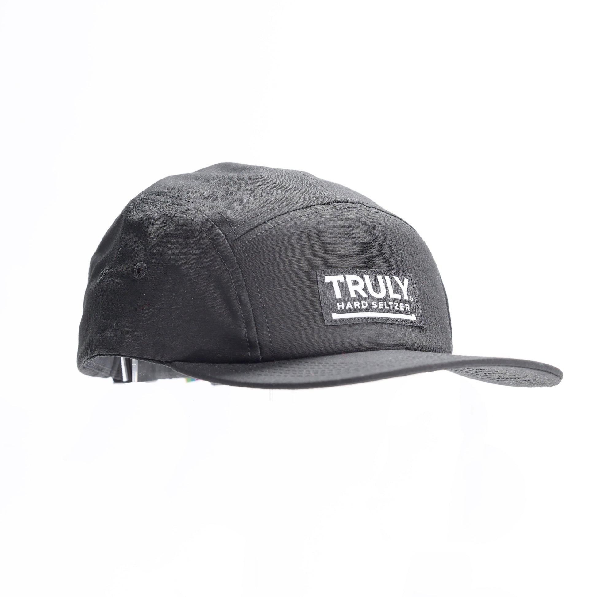 A black five-panel baseball cap with a flat brim. A rectangular patch on the front reads "TRULY HARD SELTZER" in white text.