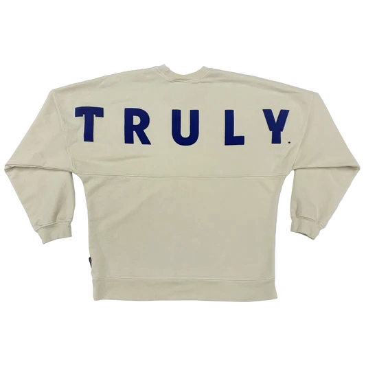 Back view of jersey with writing "TRULY" in blue.