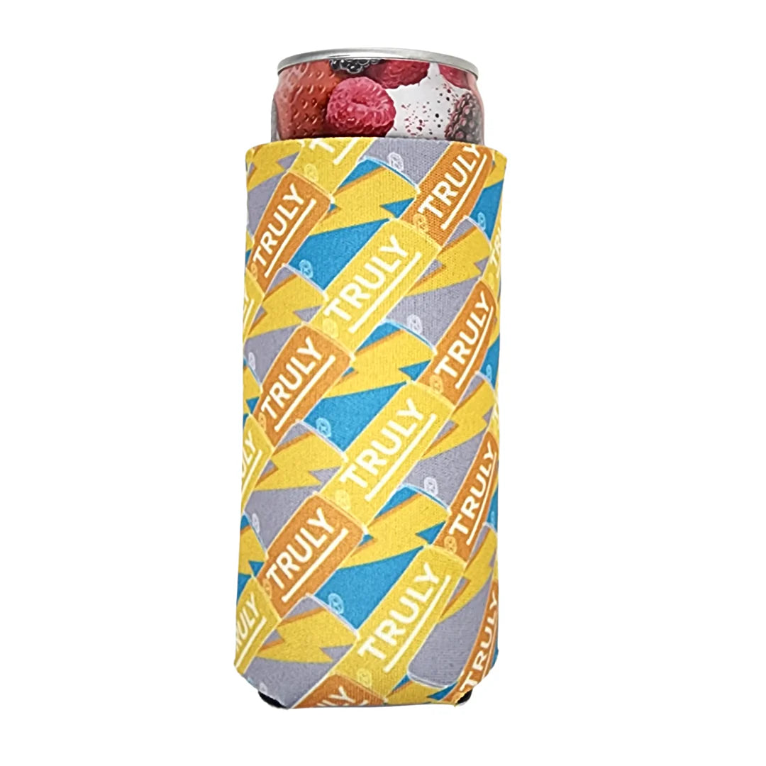 A light gray slim can cooler with a yellow, blue, and gray pattern of repeating "TRULY" logos and lightning bolts, holding a Truly Hard Seltzer can with a berry design at the top.