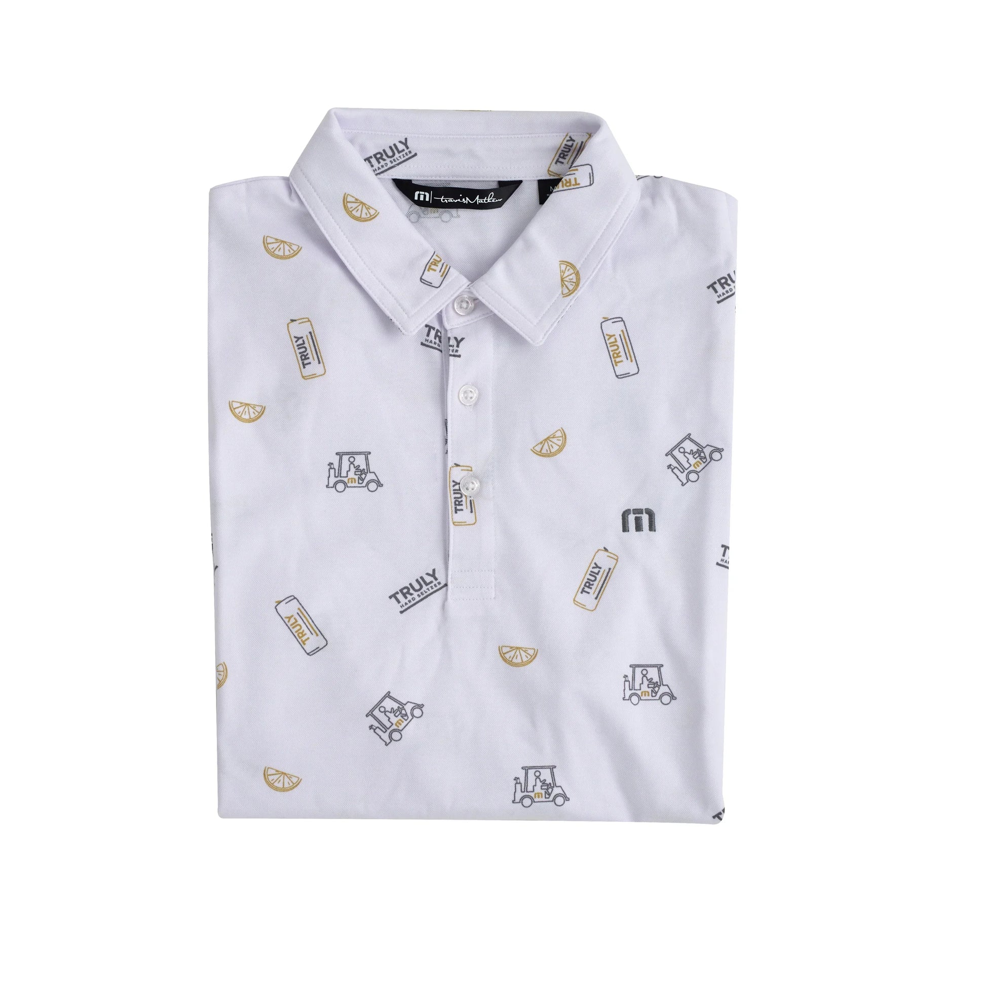 A white short-sleeved polo shirt, folded neatly, with the collar visible at the top. The shirt features a repeating pattern of small illustrations including Truly Hard Seltzer cans labeled 'TRULY', citrus fruit slices, golf carts, and a small stylized 'M' logo.