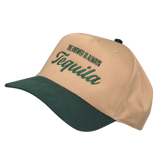 A beige baseball cap with a dark green brim, featuring the embroidered text "THE ANSWER IS ALWAYS Tequila" in dark green on the front.