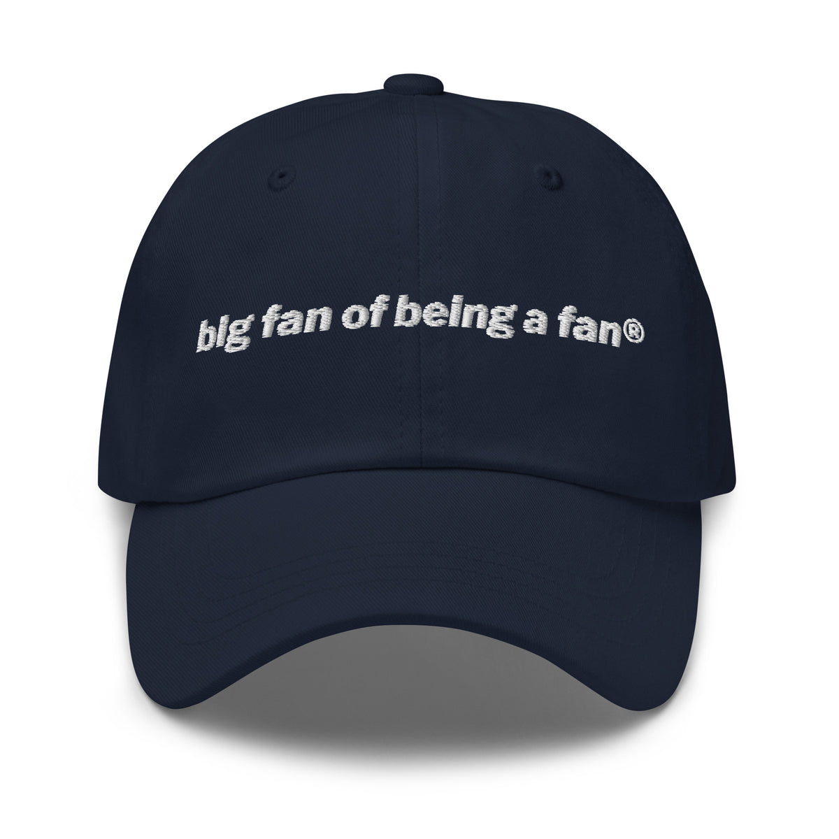 Navy cap with 'big fan of being a fan' text on a white background