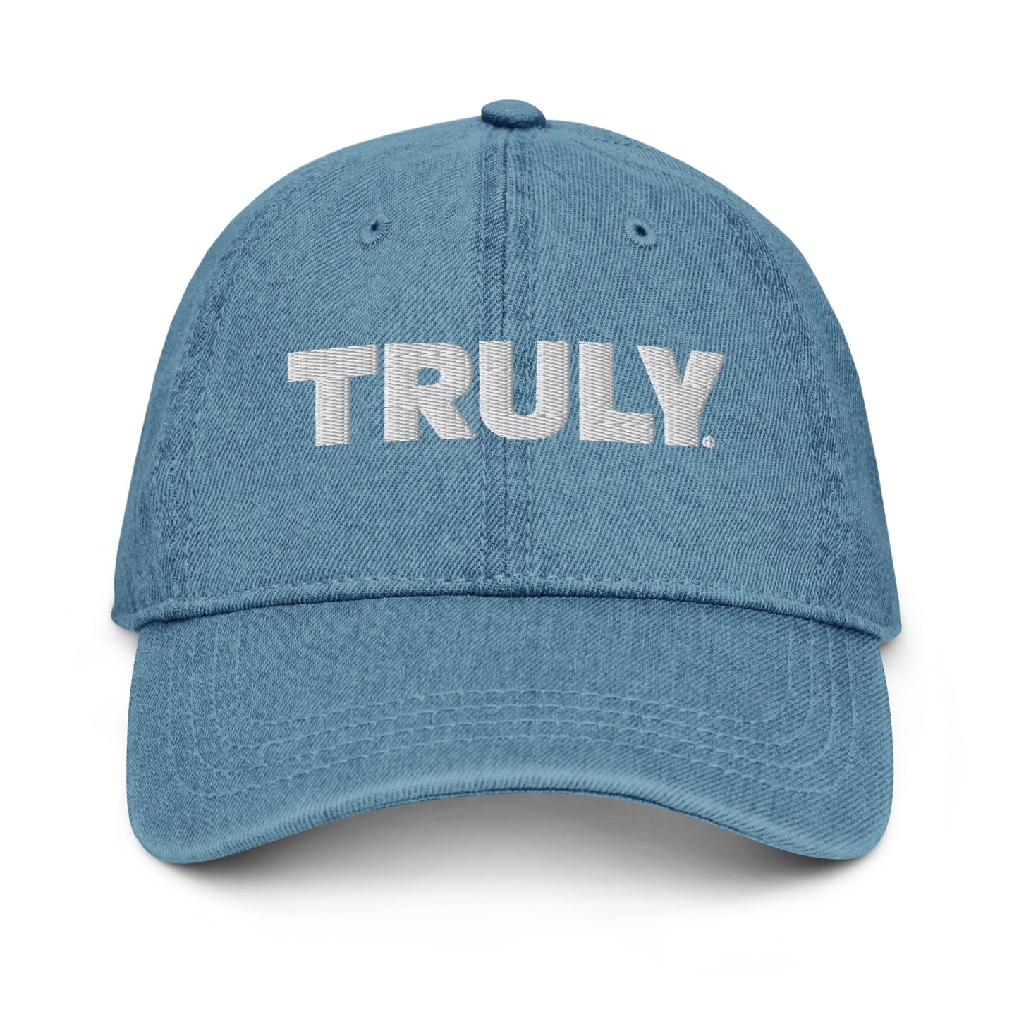 Light blue denim dad hat with a white Truly Logo front and center 