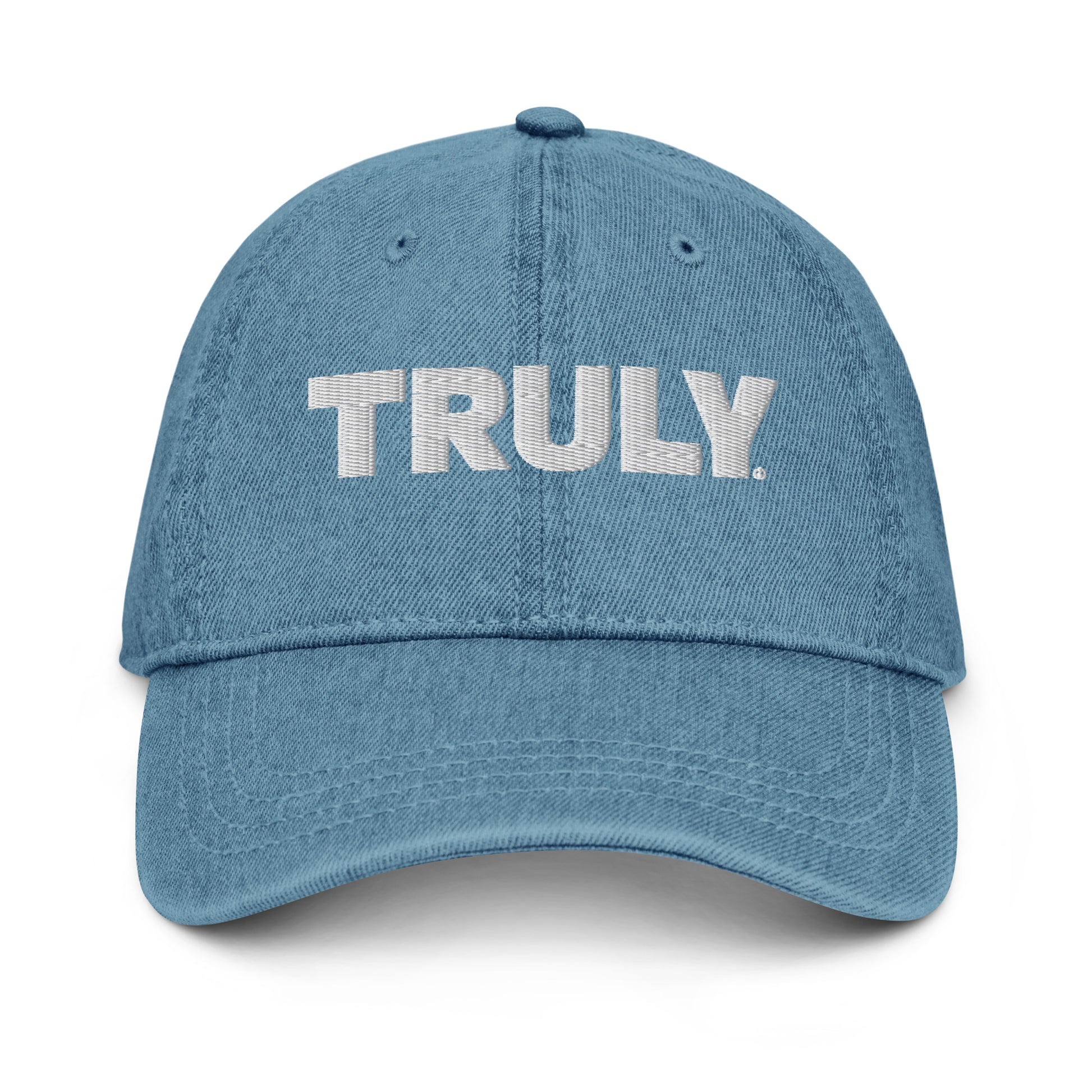 Light blue denim dad hat with a white Truly Logo front and center 
